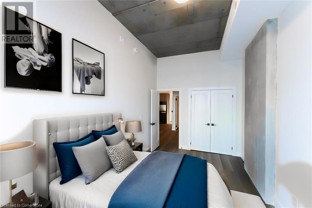 169 JAMES Street S Unit# 505=Bedroom featuring wood finished floors and a closet