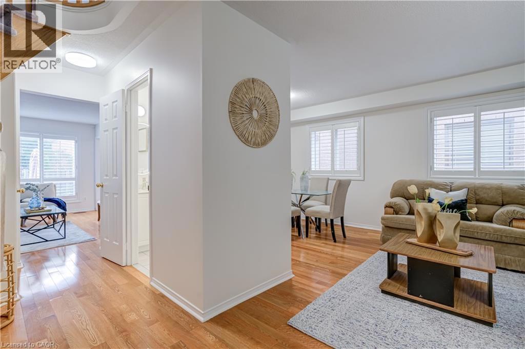 61 CEDARWOOD Crescent=Living room featuring light wood-style flooring and plenty of natural light