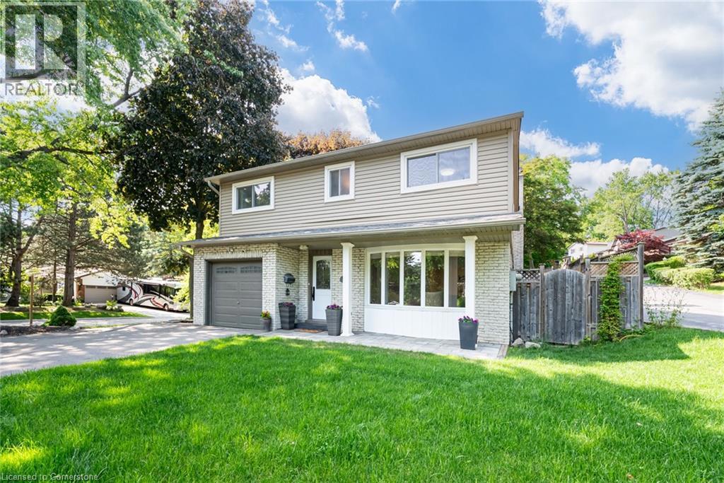 1481 OTIS Avenue=Traditional-style home with driveway, brick siding, and an attached garage
