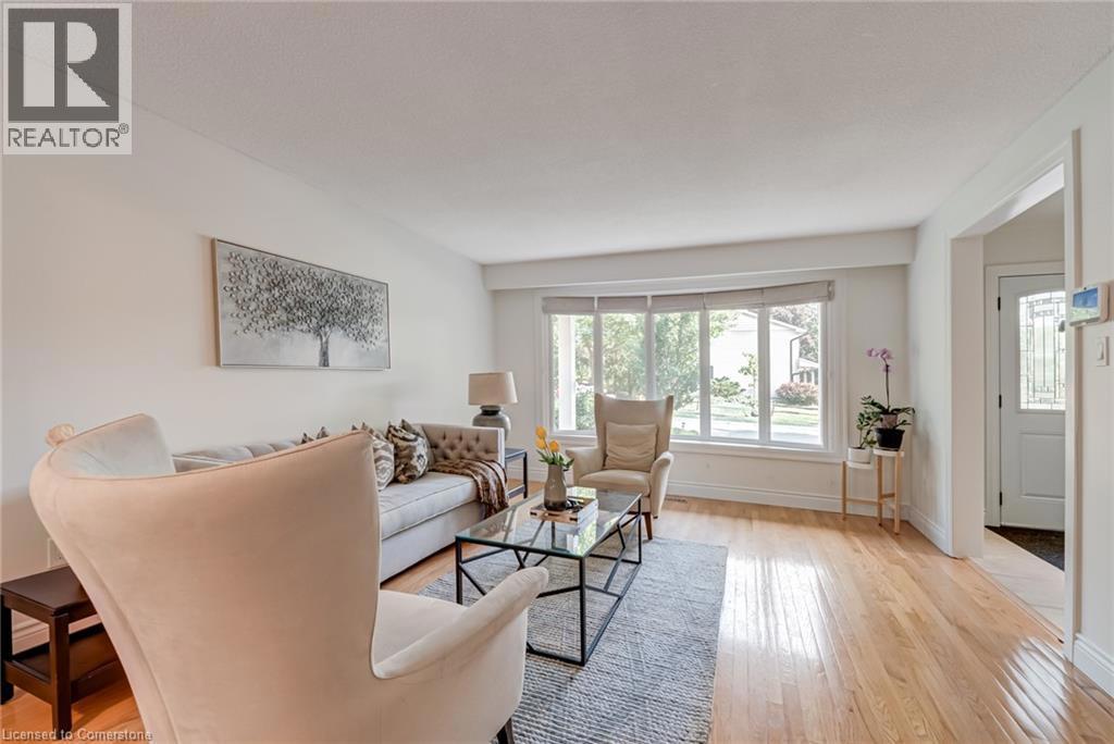 1481 OTIS Avenue=Living room featuring light wood-style flooring and baseboards