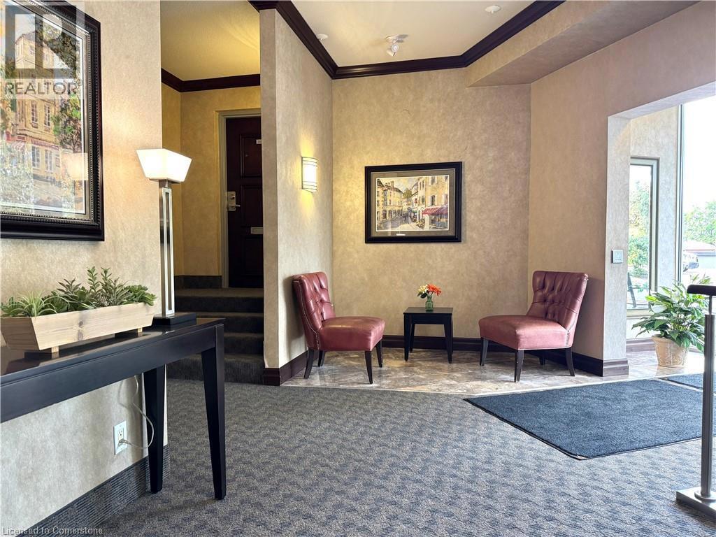 250 GLENRIDGE Drive Unit# 1103=Front lobby featuring crown molding and carpet