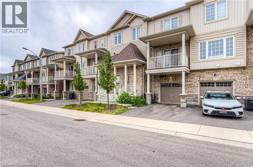 15 DEWBERRY Drive=Craftsman house with a residential view, an attached garage, driveway, and a balcony