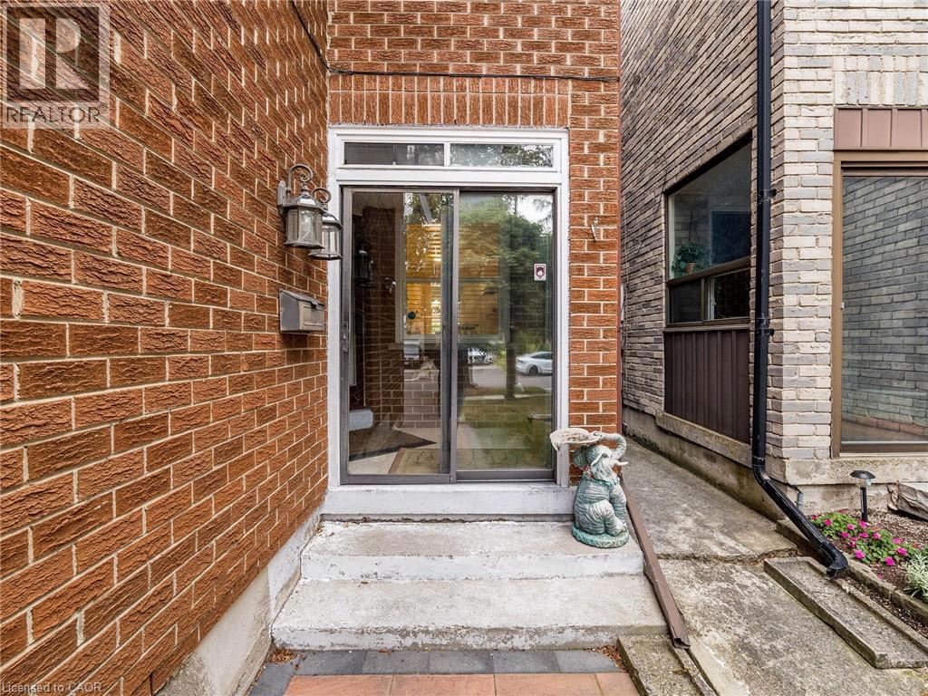69 NEW SEABURY Drive=Doorway to property featuring brick siding