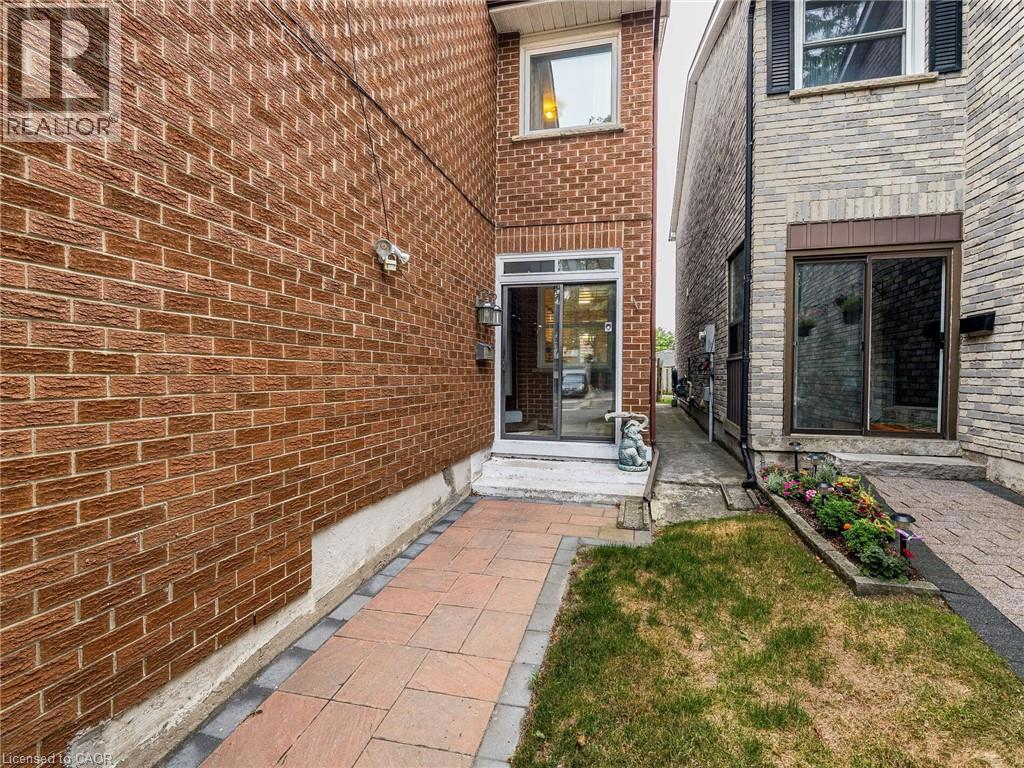 69 NEW SEABURY Drive=Property entrance featuring brick siding and a lawn