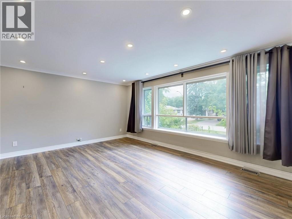 1821 CHRISTOPHER Road=Unfurnished room with wood finished floors and recessed lighting